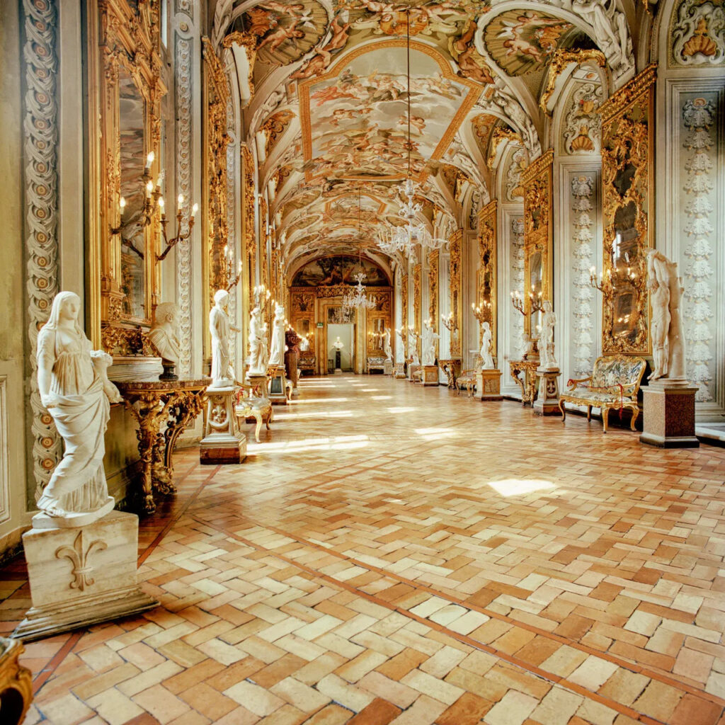 A hall featuring various works of art in the Doria Pamphilj Gallery in Rome, Italy.