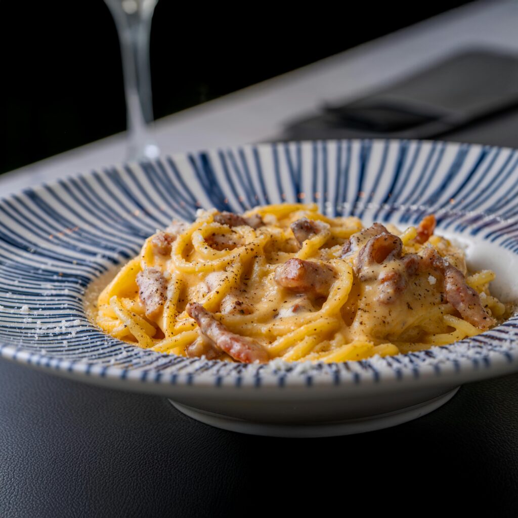 Spaghetti Carbonara in a blue bowl